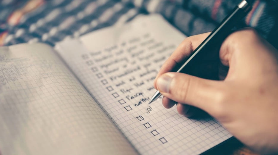 A checklist of daily to-dos being written out.