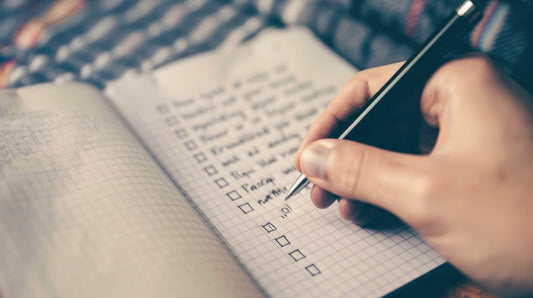 A checklist of daily to-dos being written out.