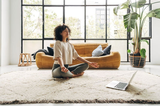 A woman practicing meditation for mental clarity.